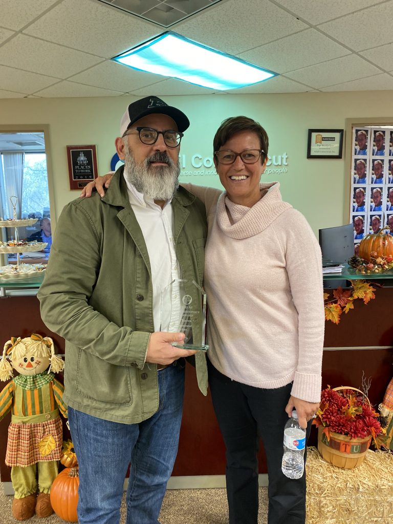Andy Torres accepts the award from Lynn Bishop